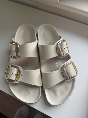 Birkenstock Cream Slide Sandals with Gold Buckles